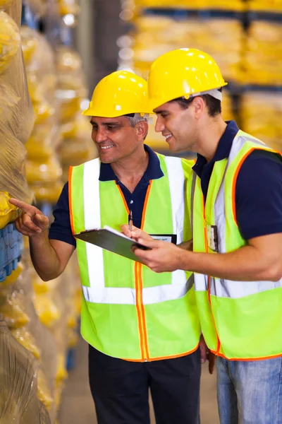 Warehouse workers doing stock take