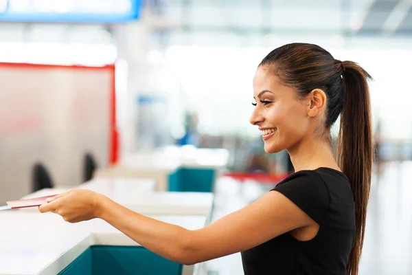 Businesswoman handing over air ticket