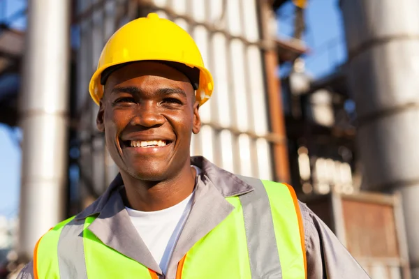 African worker in petrochemical plant