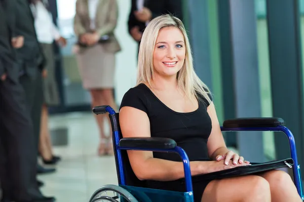 Disabled businesswoman sitting in a wheelchair