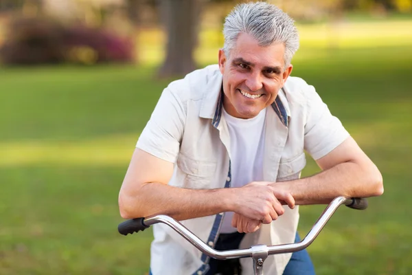 Middle aged man on a bike