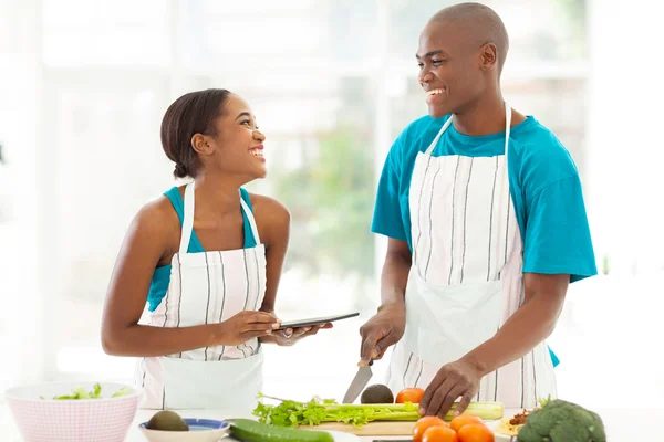 Young african couple in home kitchen