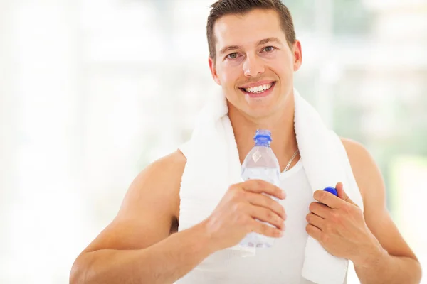 Fitness man drinking water