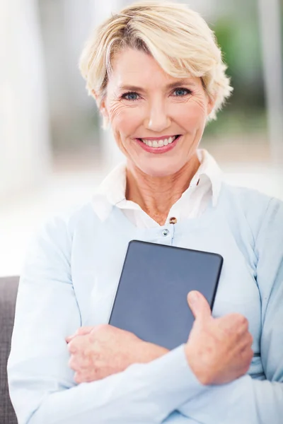 Senior woman holding tablet computer