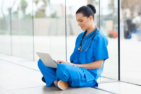 Medical nurse working on laptop