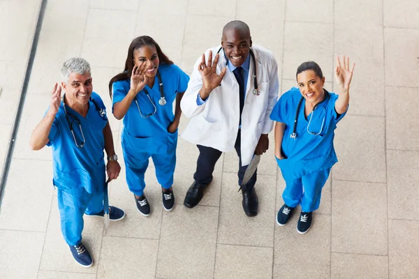 Above view of medical doctors waving