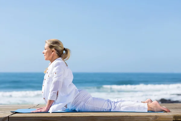 Mature womanupward dog yoga position