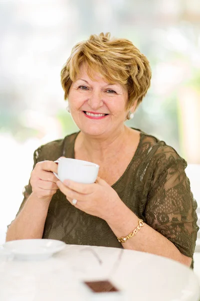 Mature woman drinking coffee