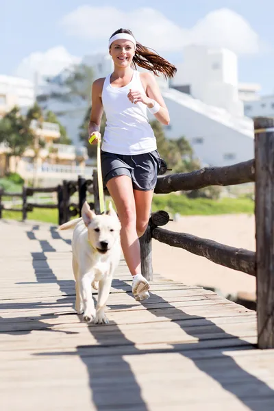 Woman jogging with her dog