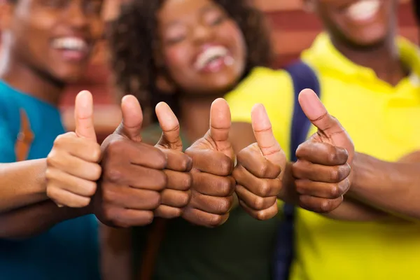 African friends thumbs up