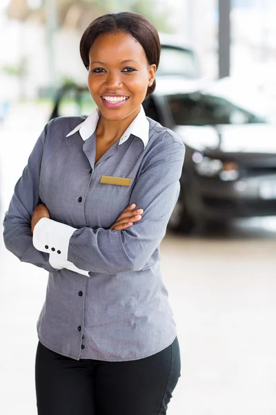 African woman in car dealership