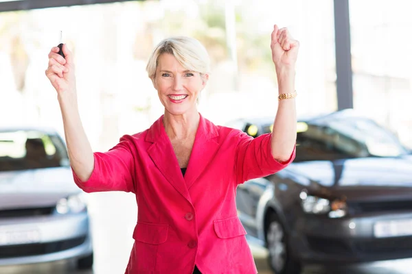 Excited woman pick up her car