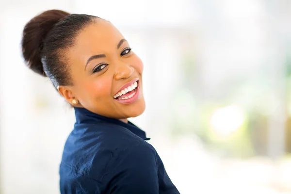 Young african american businesswoman looking back