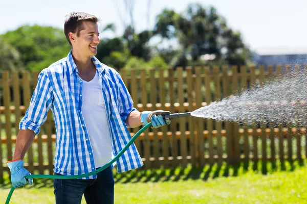 Man watering garden