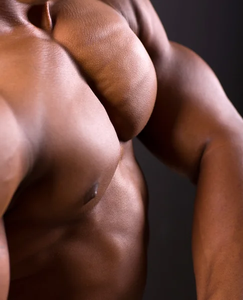 African muscular man body closeup