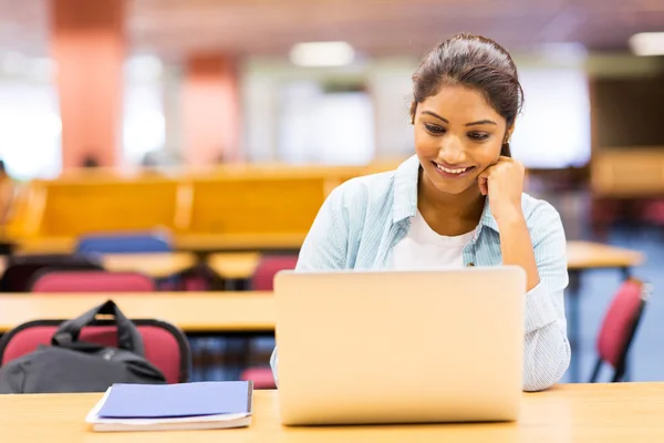 Female indian student using laptop