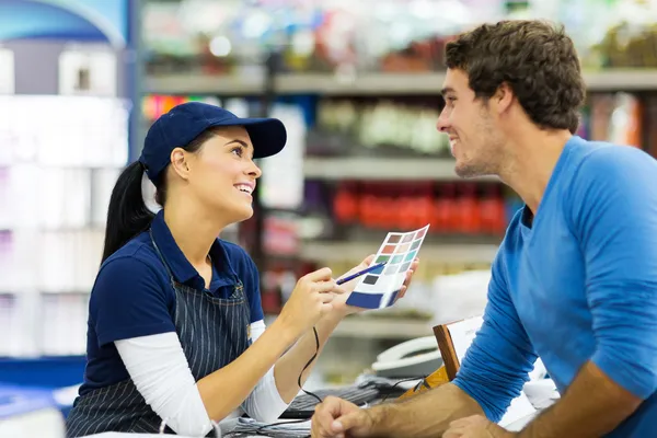 Store worker talking to customer