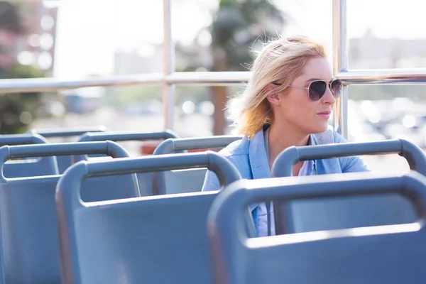 Thoughtful young woman on bus