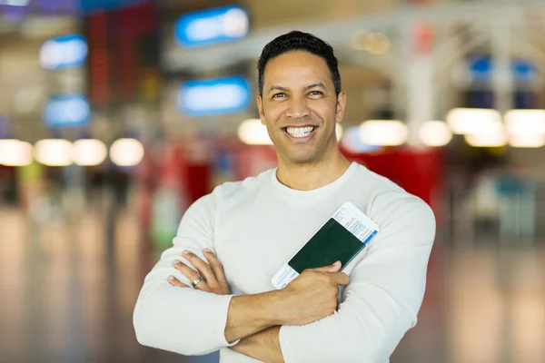 Man holding boarding pass