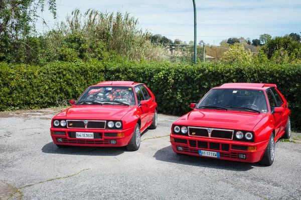 Two Red Vintage Lancia Delta Cars