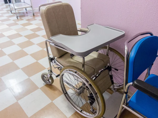 Empty wheelchair in a hospital
