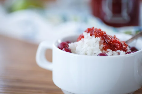 Rice porridge with jam and berries