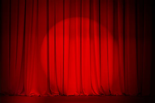 Theatre red curtain with spotlight