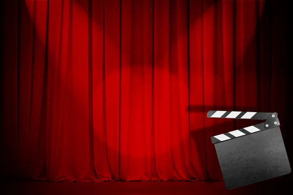 Theatre red curtain with empty clapper board