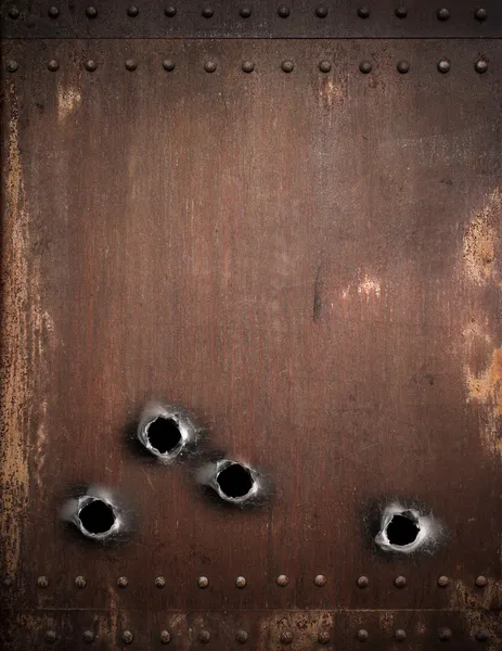 Old metal background with bullet holes
