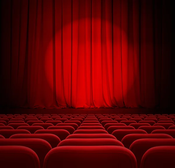 Cinema red curtains with spotlight and seats