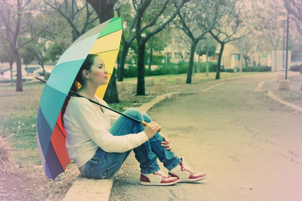 Young woman with big umbrella