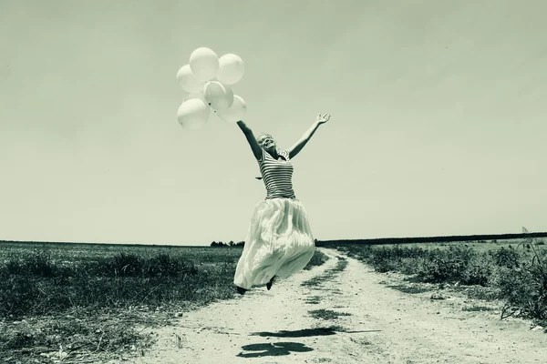 Woman holding  balloons