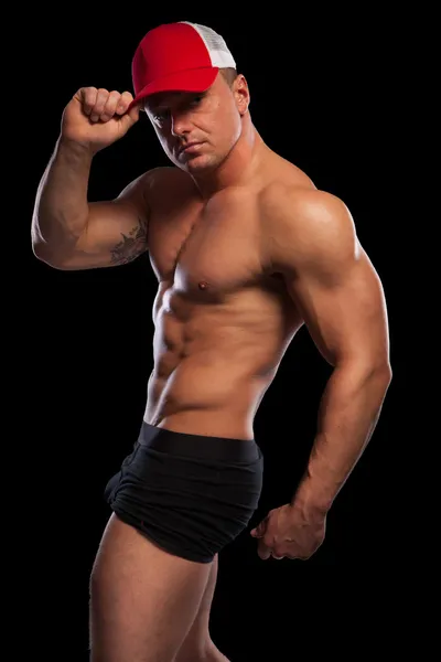 Sexy muscular man with baseball cap