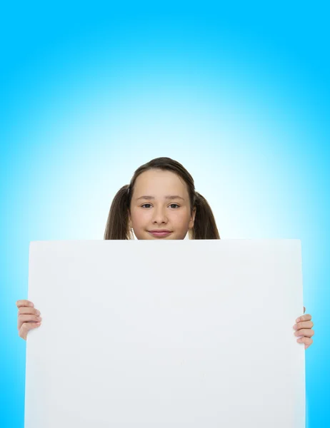 Trendy young girl holding to a blank card