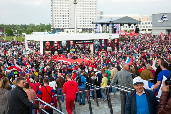 MINSK, BELARUS - MAY 9 - Swiss and Russian Fans in Front of Minsk Arena on May 9, 2014 in Belarus. Ice Hockey Championship Opening.