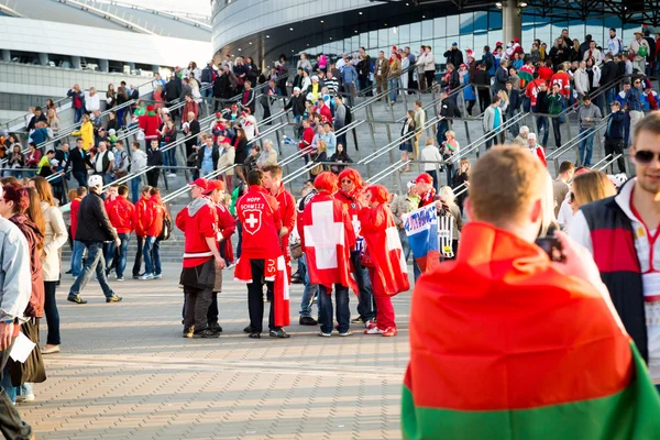 MINSK, BELARUS - MAY 9 - Belarussian, Swiss and Russian Fans in Front of Minsk Arena on May 9, 2014 in Belarus. Ice Hockey Championship Opening.