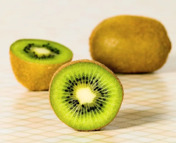 Green cutout fruit kiwi on the table