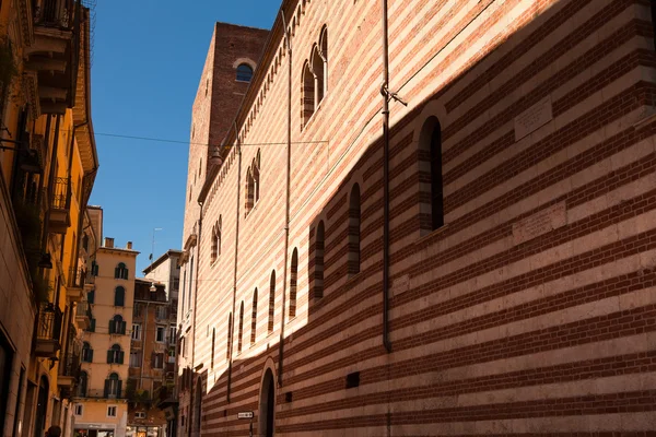 Verona, northern Italy, Ancient Street, the perspective of university brick wall, arch, Piazza della Signoria, gothic architecture