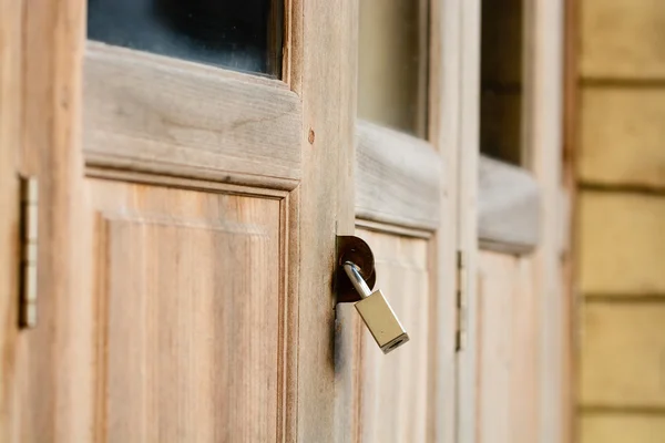 Locked wooden door with key chain background