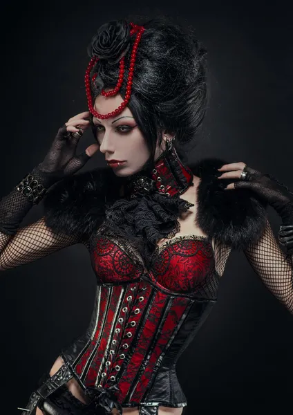 Brunette woman in gothic outfit