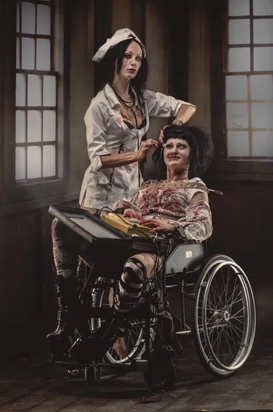 Mad nurse with sick patient in wheelchair