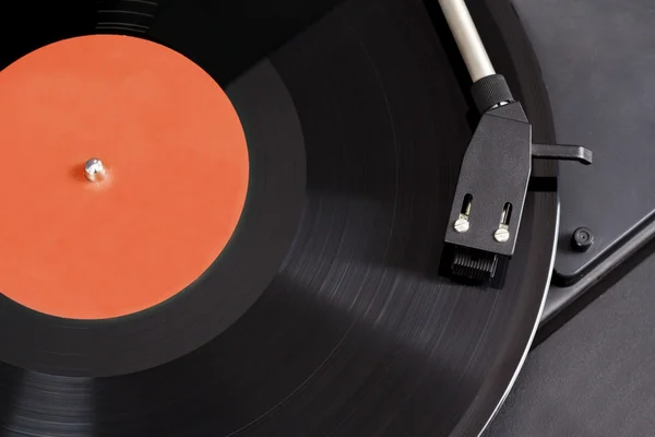 Vintage record player with spinning vinyl. Motion blur image.