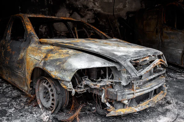 Close up photo of a burned out car