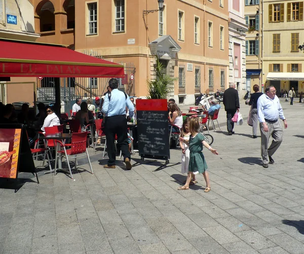 Girls dance on Place du Palais in Nice