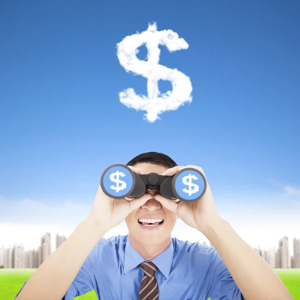 Happy businessman holding binoculars and watching the money clou