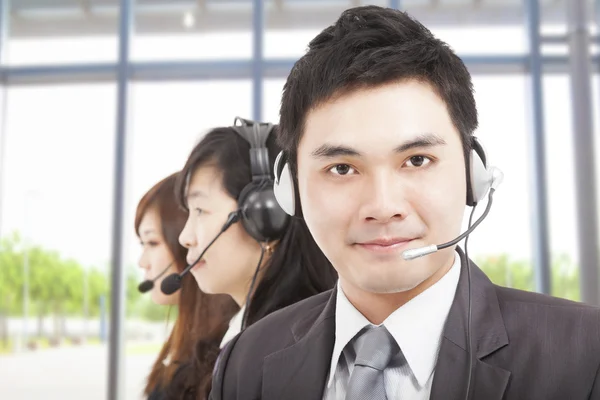 Smart asian businessman with call center agent