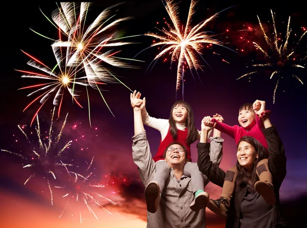 Happy asian family looking fireworks