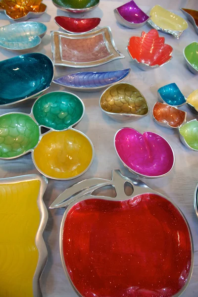 Colorful metal dishes, fair trade products in India