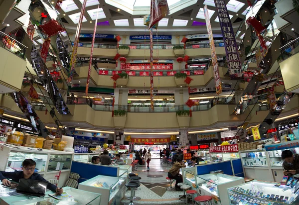 People at work in a huge Chinese electronic shopping mall in Sha