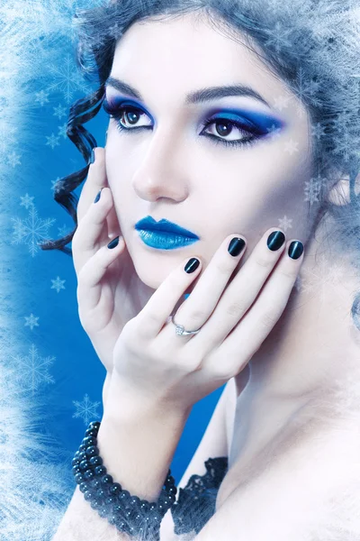 Woman with silver blue artistic make-up